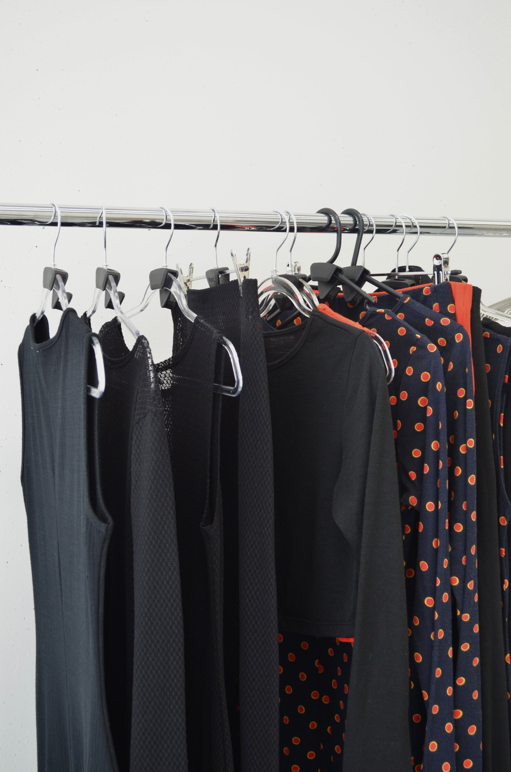 Missou clothing pieces hung up on a rail